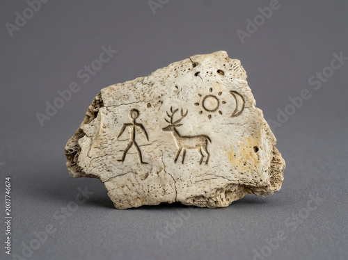 Abstract symbols carved on bones in ancient times