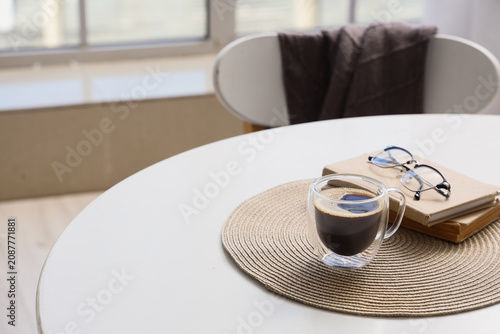 Glass cup of coffee with ey...