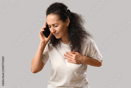 Mature woman with heart att...