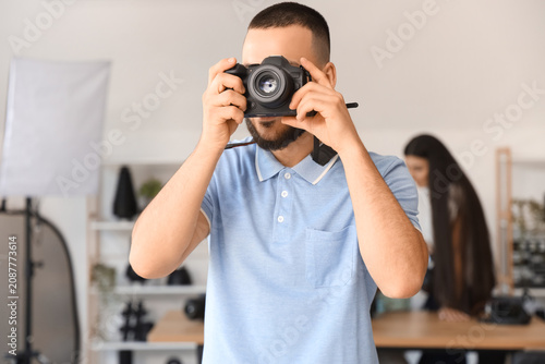 Male photographer with came...