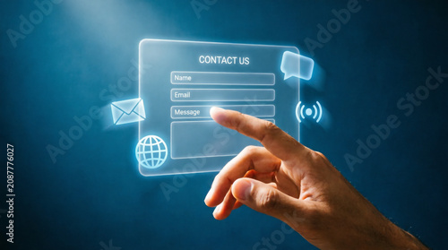 Hand touches glowing contact us hologram form with name email message and phone icons.