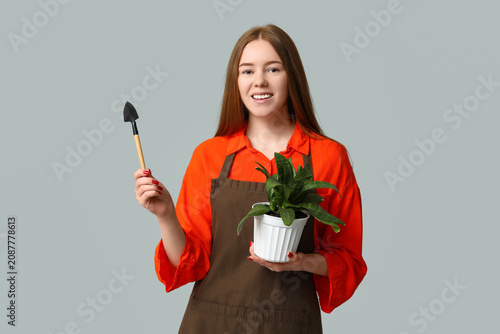 Pretty young woman with hou...