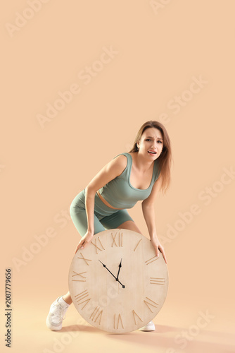 Stressed sporty young woman...