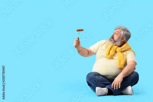 Surprised mature man with t...