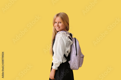 Cute schoolgirl with backpa...