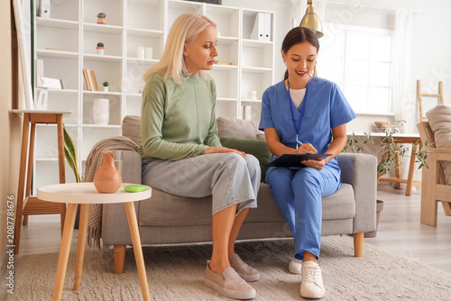 Mature woman with doctor at...