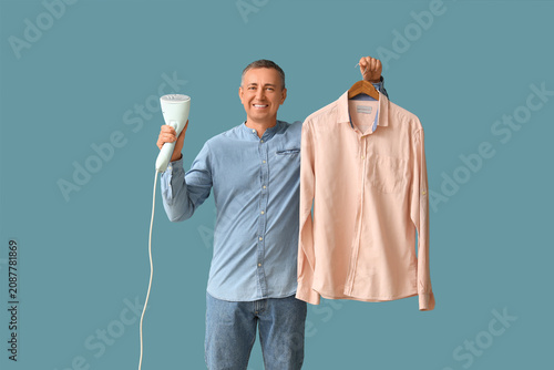 Mature man with steamer and...