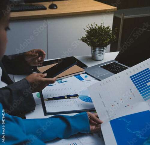 Auditor and accountant team working in office, analyze financial data and accounting record with calculator. Accounting company provide finance and taxation planning for profitable cash flow.