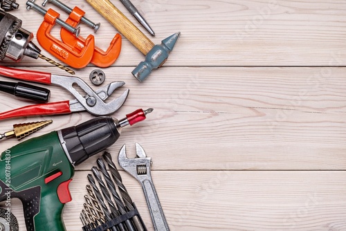 Tools and Hardware Spread on Wooden Workbench.