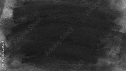 Cuadro en lienzo A smudged and textured dark background resembling a used chalkboard or smeared charcoal art with uneven edges