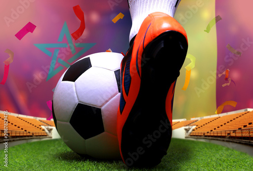 Close up legs and feet of soccer player or football player walk on green grass ready to play match on national Morocco and national Belgium.