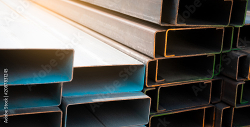 Fotografie Industrial warehouse stock of rectangular metal pipes for building and construction supplies