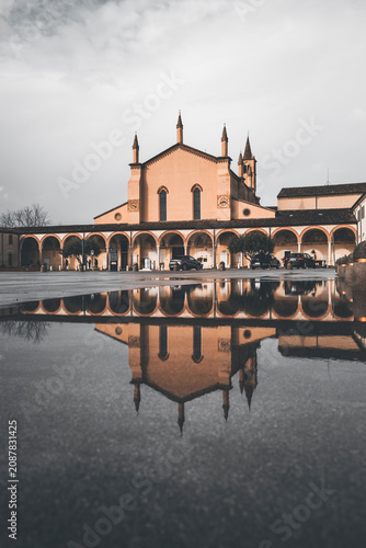 фотографія reflection of a church in mantova after a rainstorm