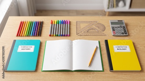 A student workspace featuring colorful markers, geometric drafting tools, a calculator, and two notebooks labeled History and Biology, set on a wooden desk, evoking a clean