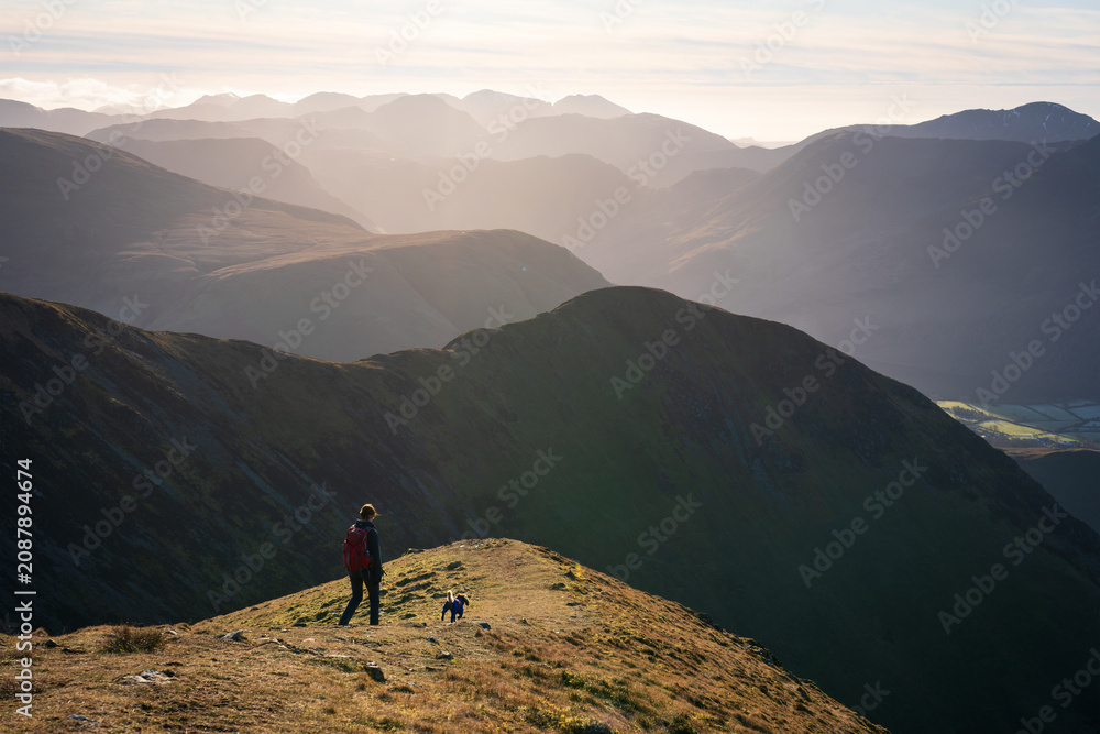 Obraz premium Views across Rannerdale, Crummock Water with the summit of Mellbreak in the distance in the Lake District on a sunny winters morning in Cumbria, England UK.