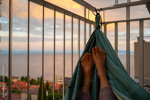 Konstfotografi First-person perspective from a hammock on a residential balcony overlooking the