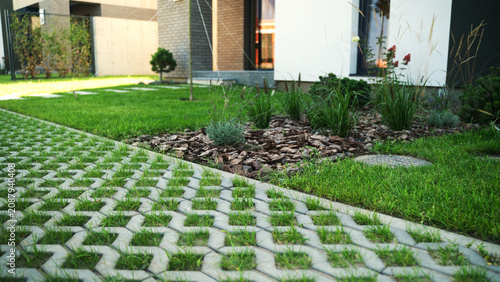 Bild auf Leinwand Green lawn pavement creating an eco-friendly modern garden landscape design at a