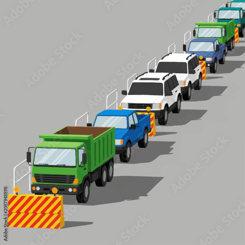 Colorful construction vehicles lined up in a row.