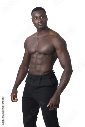  view of Shirtless man posing and looking at camera on white background.