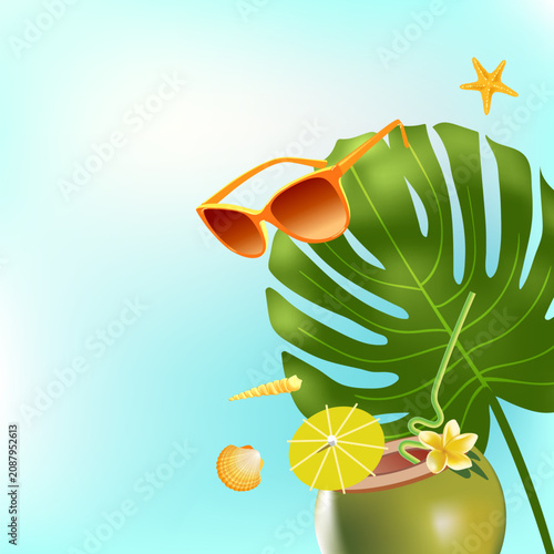 Tropical coconut with fresh fruit and tropical flowers. Sun-glasses rest on large green monstera leaf. Seashell and starfish add beachy charm. Bright yellow lemon slice garnishes the drink