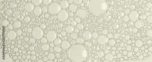 The texture of the foam of shower gel or soap suds. Macrophotography