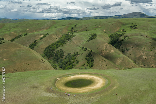 Aerial View of the Eye of Genyen: Natural Pond and Alpine Meadow in Garze, West Sichuan