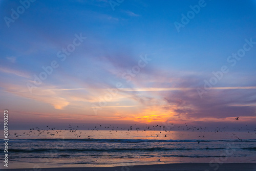 Canvas Print dramatic photograph of an Atlantic coastal sunset, showing a dark, turbulent sea