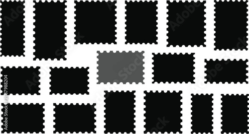 Canvas Print Collection of black perforated postage stamp shapes with one grey stamp centered