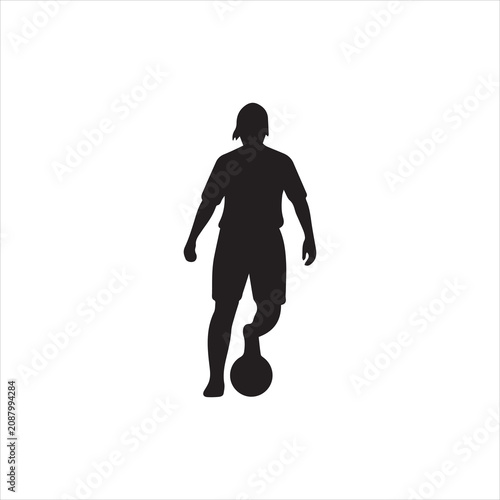 Black silhouette of a male soccer player standing and controlling the ball.