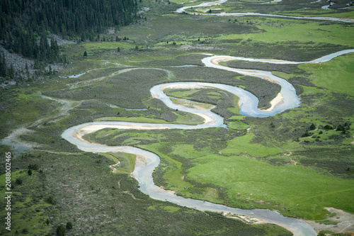 Aerial Close-up of Meandering Rivers and Wetlands on Genyen South Route