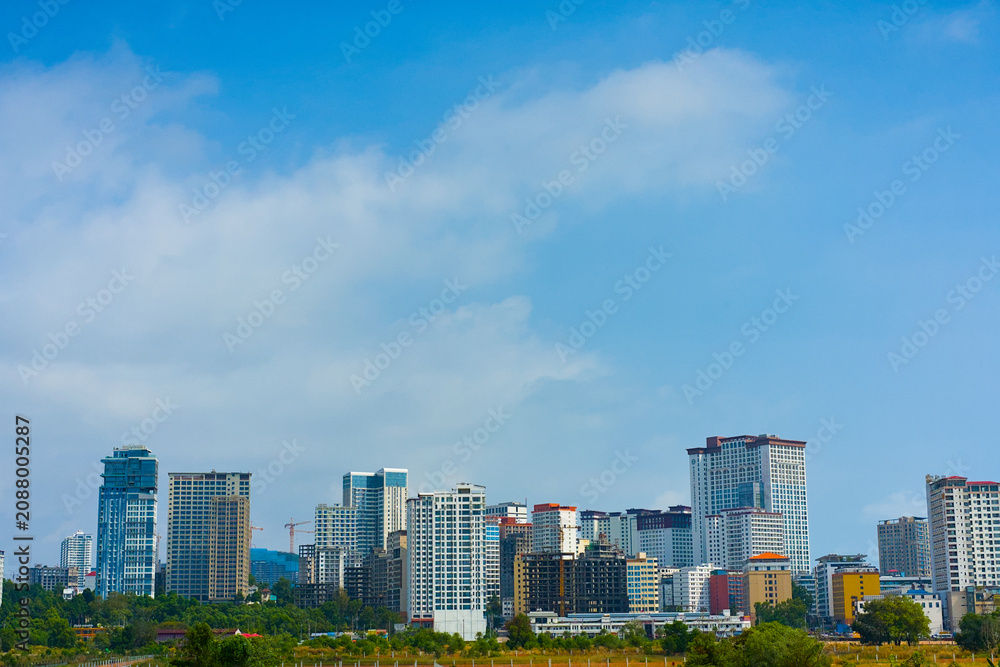 Fototapeta premium 青空と都市景観のビル