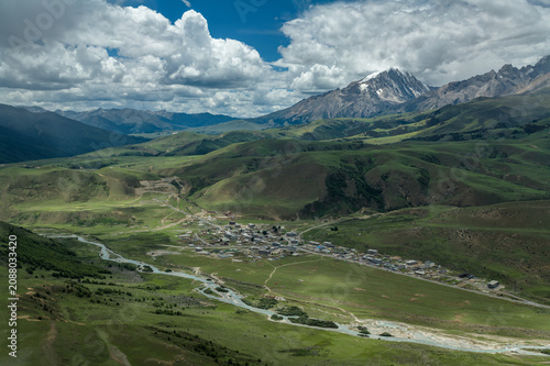 Aerial View of Mount Genyen: Xiazetong Village, Ranrika Village and Alpine Meadows in Summer