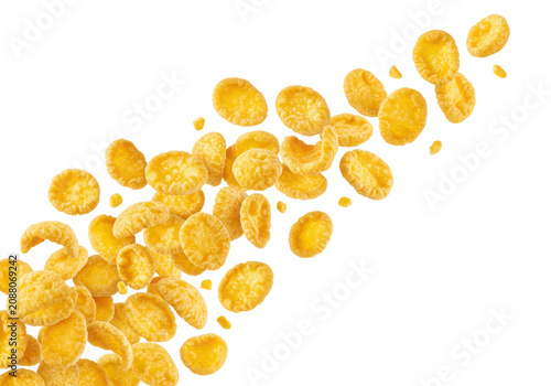 Photorealistic macro of golden-yellow corn flakes with crispy texture, falling in a dynamic, curved stream against a transparent studio background, copy space, concept for healthy breakfast cereals