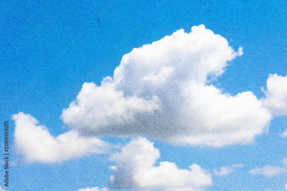 Obraz premium Single cloud isolated over blue sky background. White fluffy cloud photo, beautiful cloud shape. Climate concept