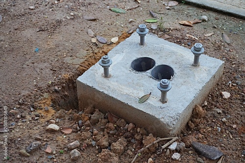 Obraz na plátne Cement and screw construction, base for street lights