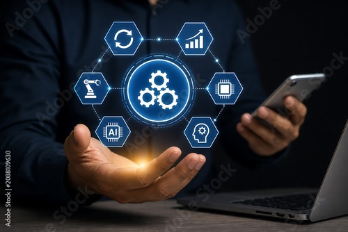Hands holding smartphone with glowing digital technology icons and laptop on desk