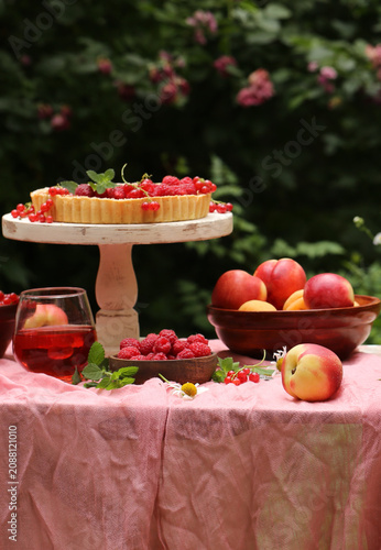 outdoor picnic with fresh berries and baked goods