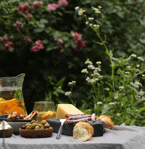 outdoor picnic with fresh berries and baked goods