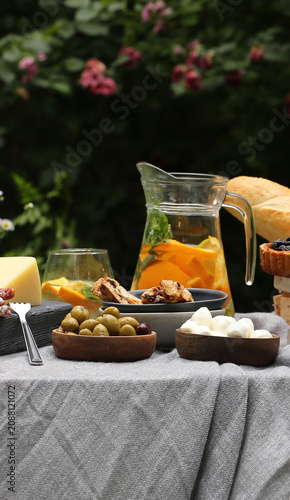 outdoor picnic with fresh berries and baked goods