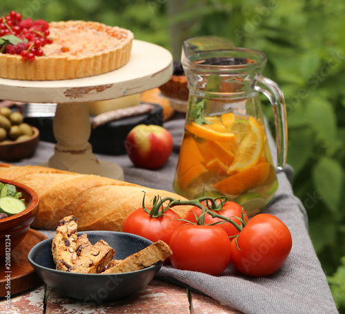 outdoor picnic with fresh berries and baked goods