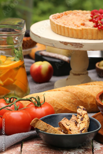 outdoor picnic with fresh berries and baked goods