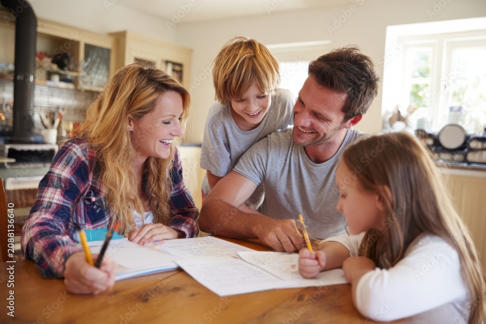 Fototapeta premium Caucasian Family of Four Cheerfully Spending Time Together Happy