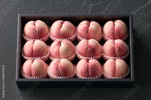 Twelve Korean peaches in a gift box top view, premium summer fruit gift set
