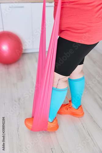 Exercising with resistance band at home training