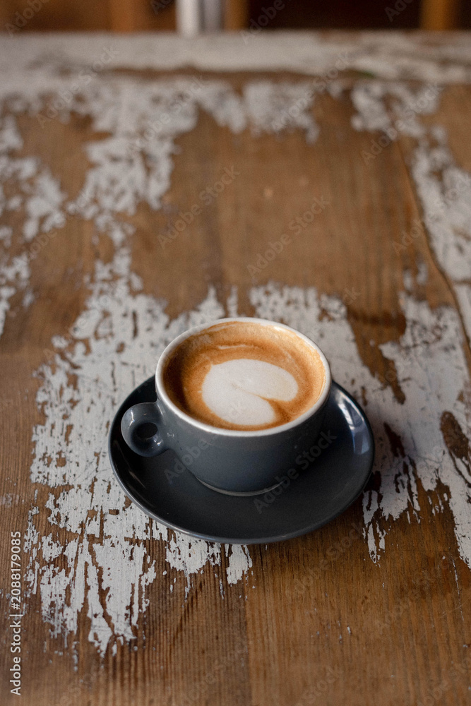 Obraz premium Minimalist café interior with a cup of coffee
