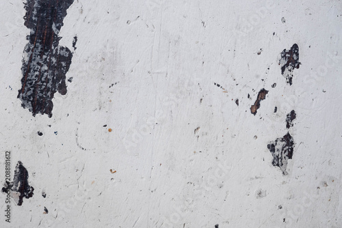 Weathered white painted wooden surface with peeling paint and rustic texture. Minimal background with generous copy space, natural light, visible film grain and an analog-inspired aesthetic.