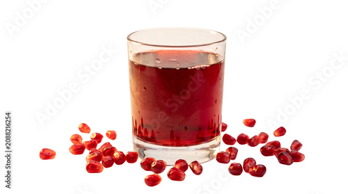 Fresh pomegranate juice in a glass, organic red fruit drink with scattered seeds, healthy antioxidant beverage for wellness and nutrition isolated PNG with Transparent Background