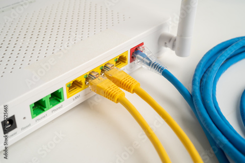 Fotografie Ethernet cable with wireless router connect to internet service provider network