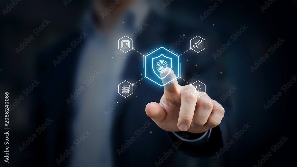 Fototapeta premium Digital Security Fingerprint Identification Concept, businessman touching glowing shield icon with fingerprint and network nodes for biometric access, identity and cyber protection