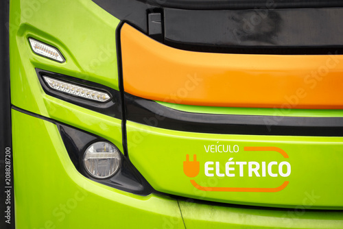 Front view of a bus highlighting the LED headlight assembly, bodywork finish, and electric vehicle identification.